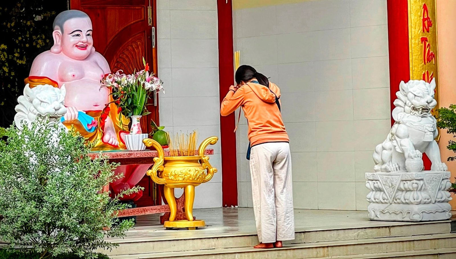 Woman making incense offering at q pagoda, Soc Trang, Vietnam